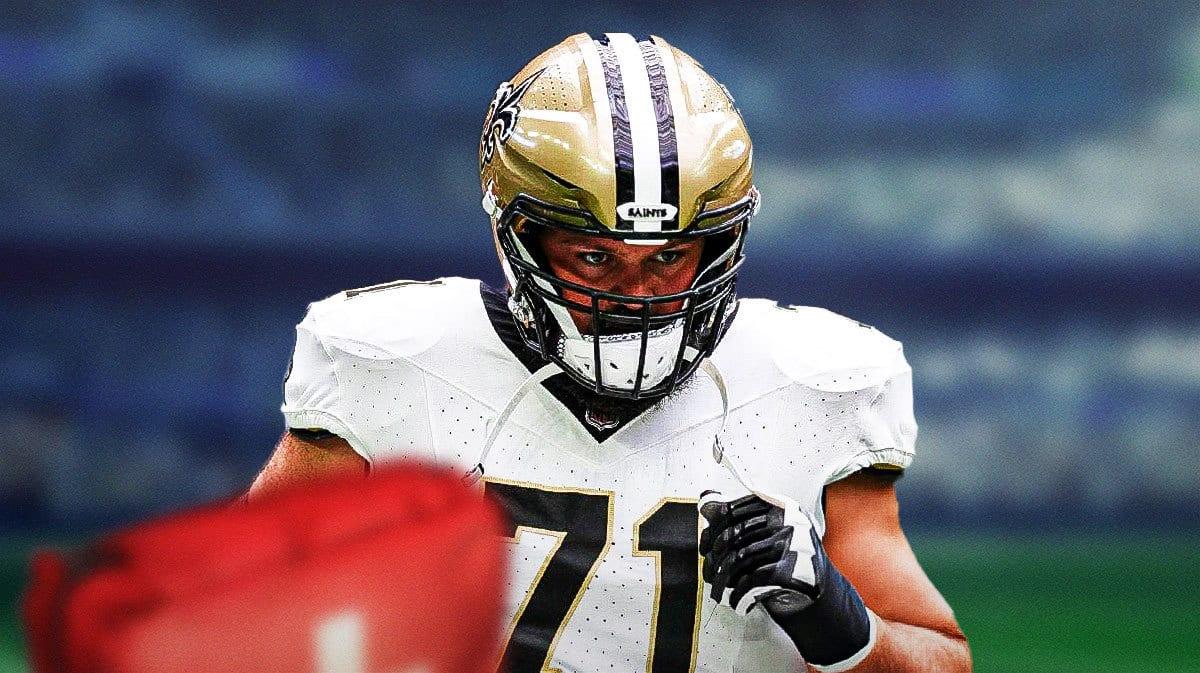 Ryan Ramczyk (Saints) with medical cross symbol in the background