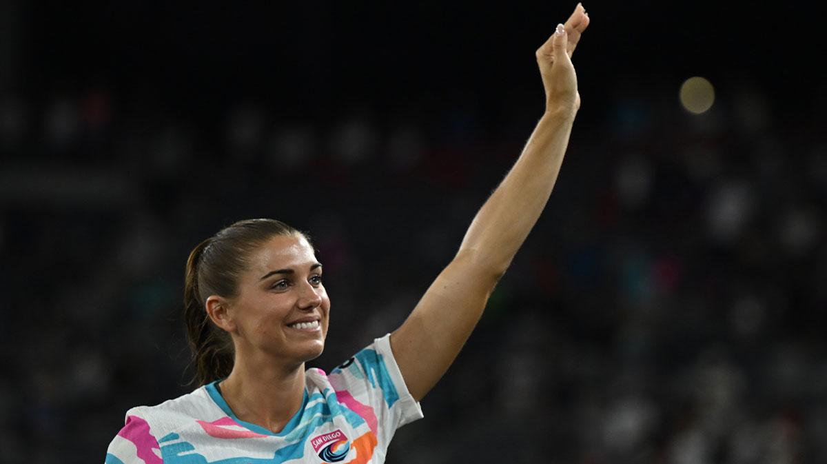 San Diego Wave FC forward Alex Morgan (13) waves to fans while walking off the field following her final match before retiring at Snapdragon Stadium.