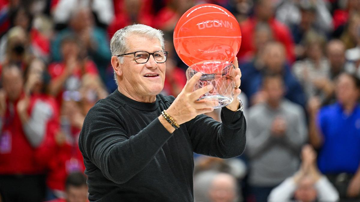 UConn Huskies head coach Geno Auriemma holds an award before a game between the Connecticut Huskies and the Fairleigh Dickinson Knights at Harry A. Gampel Pavilion.