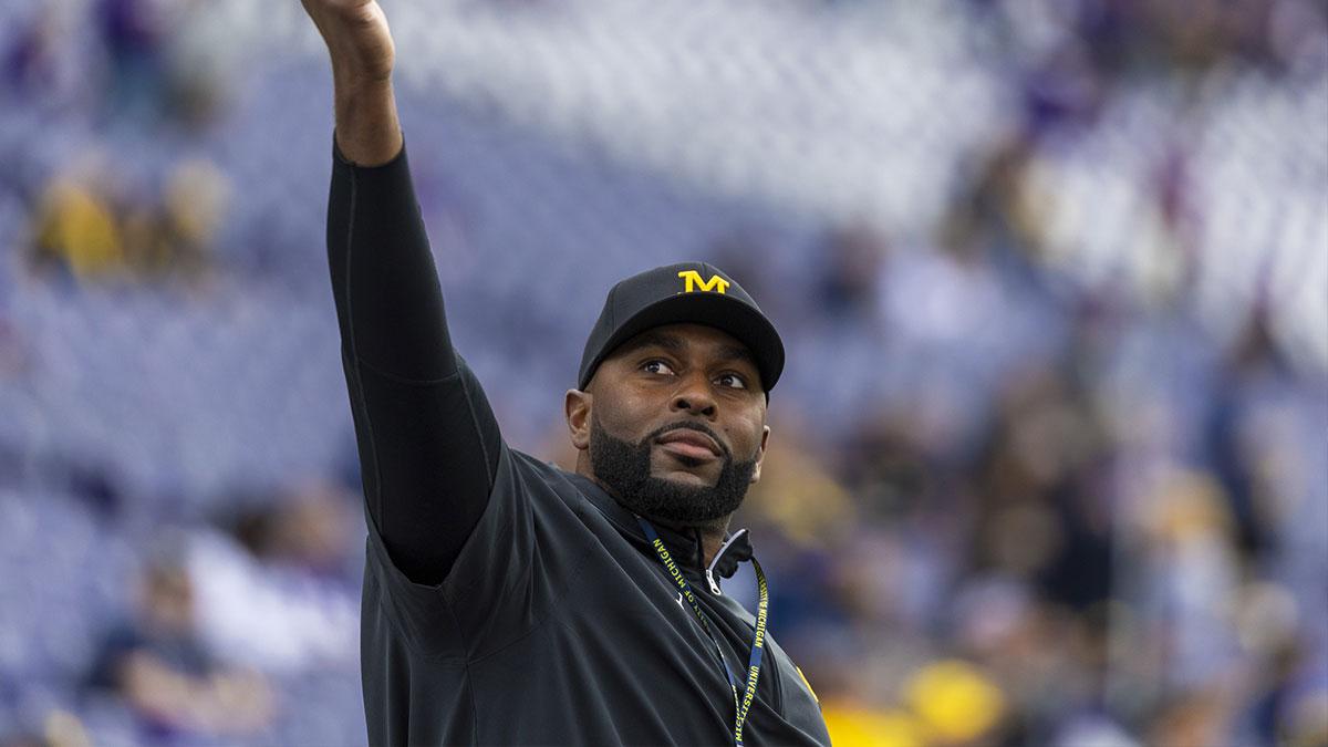 Michigan Wolverines head coach Sherrone Moore walks out of the locker room during pregame warmups against the Washington Huskies at Alaska Airlines Field at Husky Stadium.