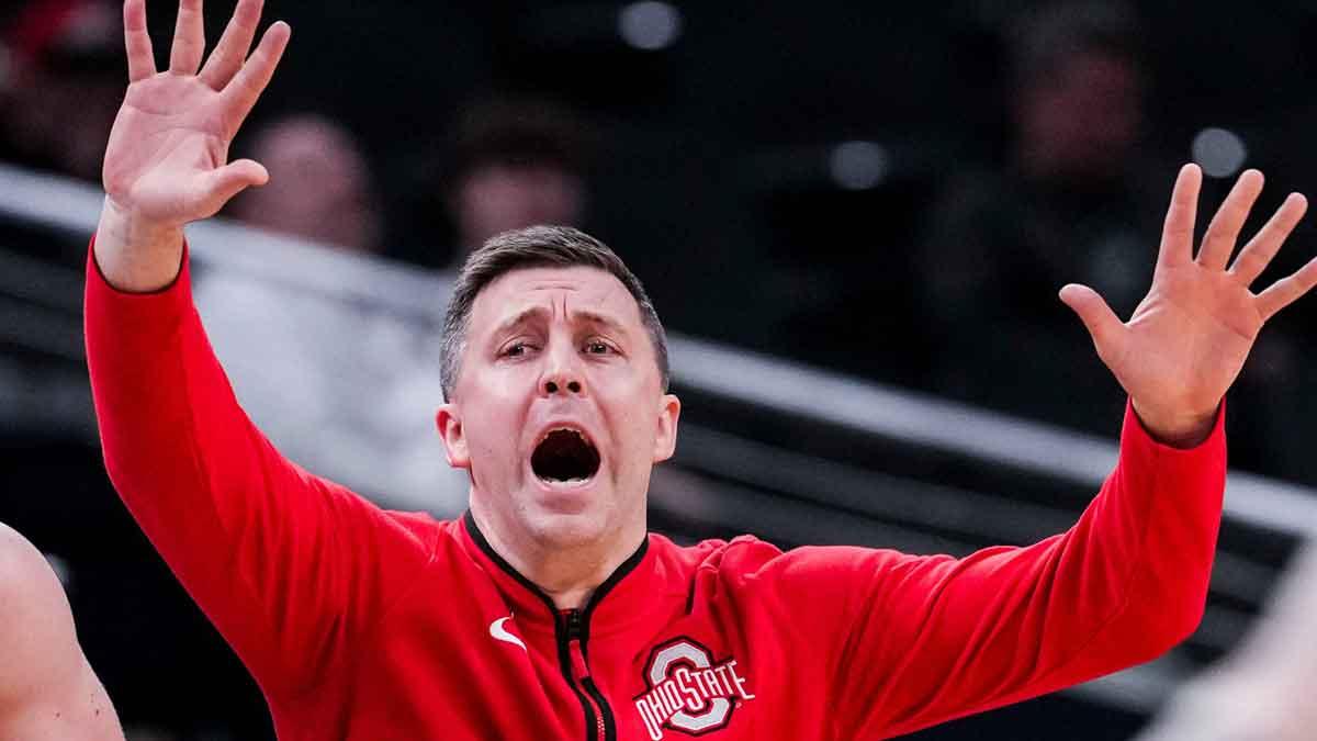 Ohio State Buckeyes head coach Jake Diebler calls a play in a first round game at the 2025 TIAA Big Ten Men’s Basketball Tournament between the Iowa Hawkeyes and the Ohio State Buckeyes at Gainbridge Fieldhouse in Indianapolis.