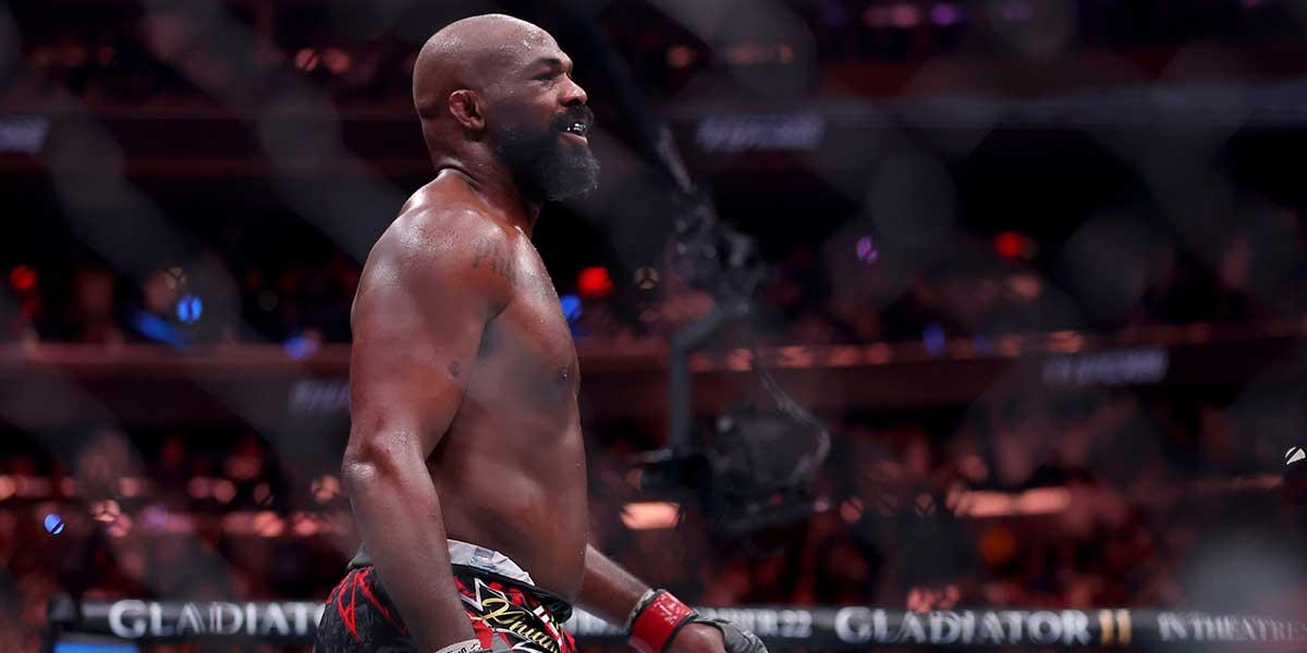 Jon Jones (red gloves) reacts after defeating Stipe Miocic (not pictured) in the heavyweight bout during UFC 309 at Madison Square Garden.