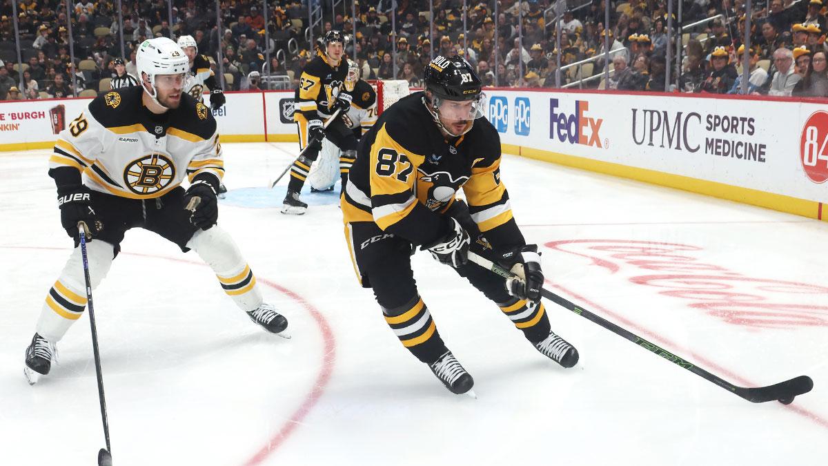 Pittsburgh Penguins center Sidney Crosby (87) skates with the puck against Boston Bruins defenseman Parker Wotherspoon (29) during the third period at PPG Paints Arena.