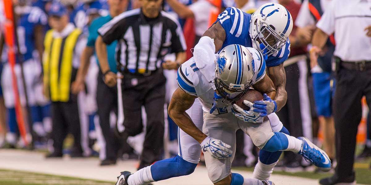 Detroit Lions wide receiver Marvin Jones (11) is tackled by Indianapolis Colts defensive back Antonio Cromartie (31) in the second half of the game at Lucas Oil Stadium. the Detroit Lions beat the Indianapolis Colts by the score of 39-35.