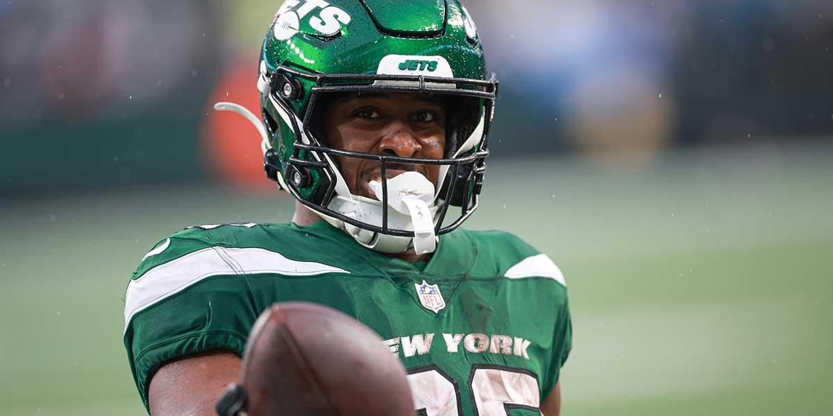 Dec 10, 2023; East Rutherford, New Jersey, USA; New York Jets running back Breece Hall (20) celebrates after a touchdown reception during the second half against the Houston Texans at MetLife Stadium. Mandatory Credit: Vincent Carchietta-Imagn Images