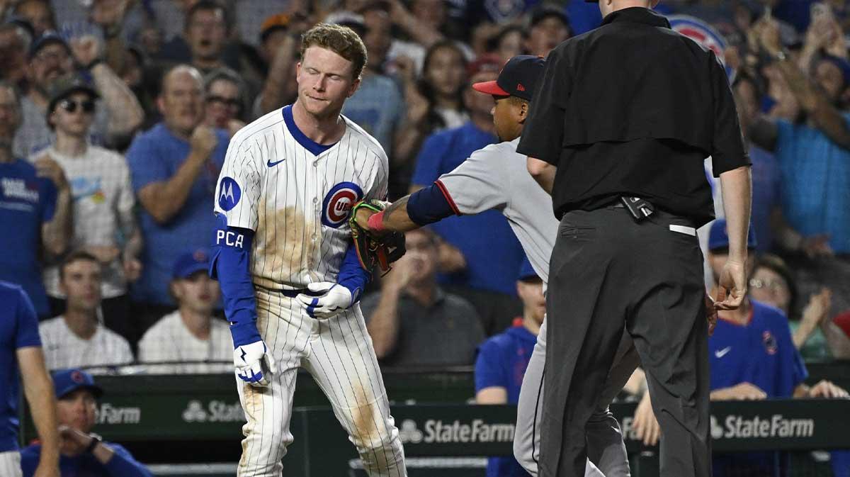 Chicago Cubs outfielder Pete Crow-Armstrong (4) os tagged out at third by Cleveland Guardians third base José Ramírez (11) during the fourth inning at Wrigley Field.