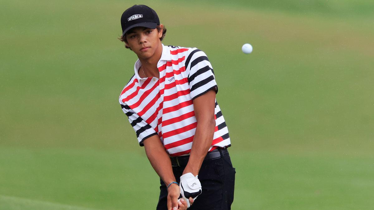 Charlie Woods of Jupiter, Fla. chips on on the 13th hole during the third and final round of The Junior Players Championship golf tournament at TPC Sawgrass