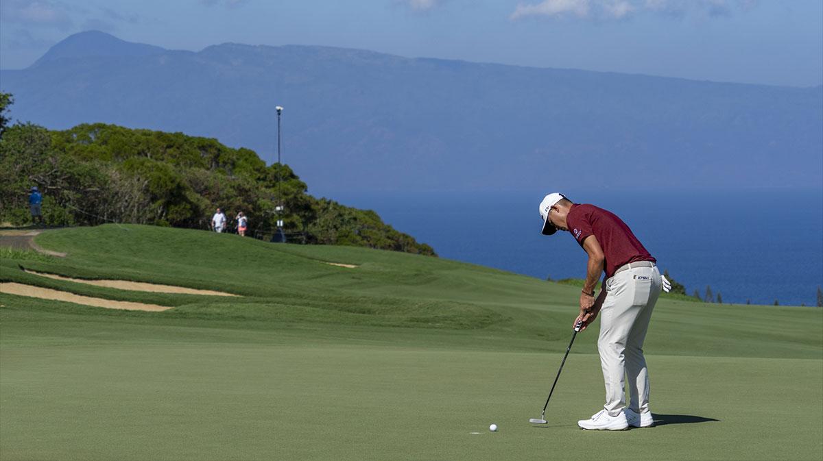 Collin Morikawa putts on the fourth hole during the final round of The Sentry golf tournament at Plantation Course at Kapalua.
