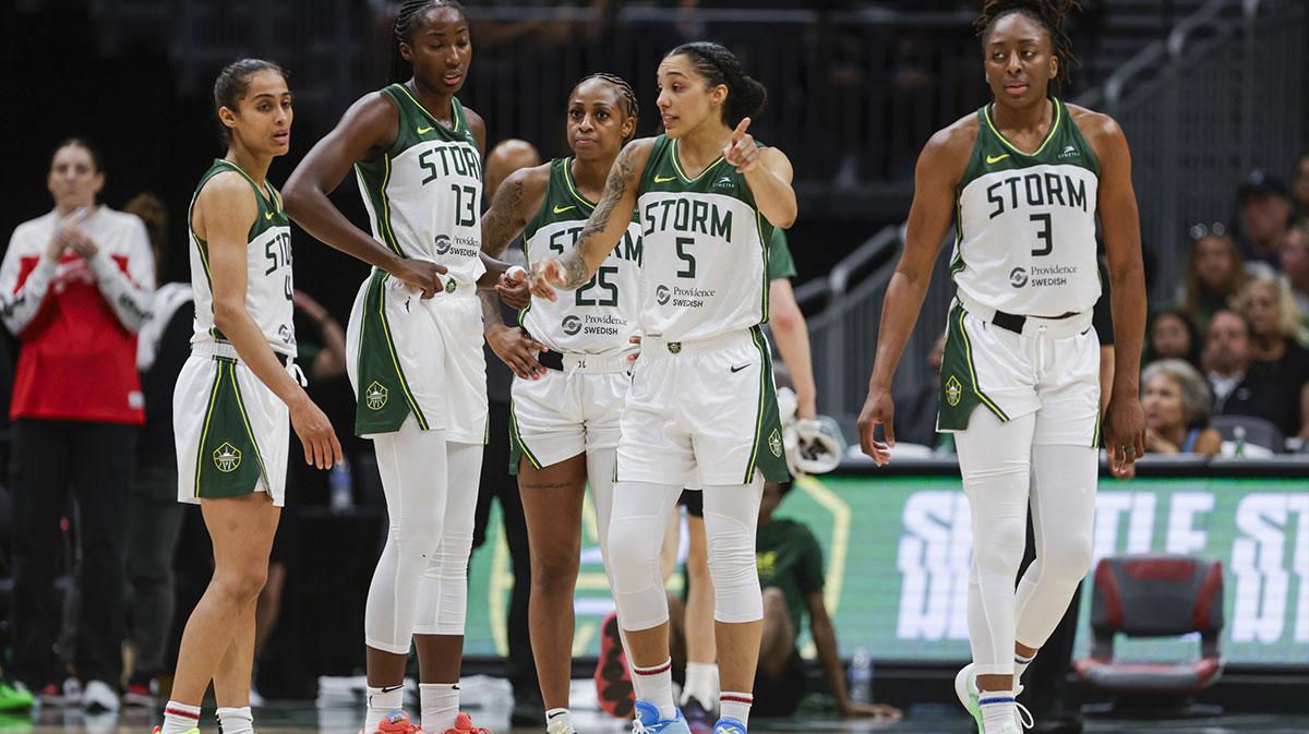 Seattle Storm guard Skylar Diggins (4), forward Ezi Magbegor (13), guard Tiffany Mitchell (25), forward Gabby Williams (5) and forward Nneka Ogwumike (3) talk following a fourth quarter timeout against the Washington Mystics at Climate Pledge Arena.