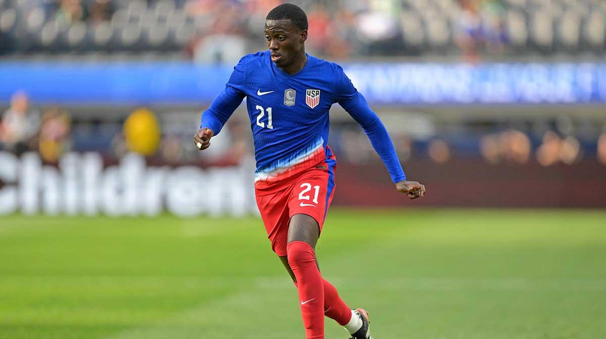 United States of America forward Tim Weah (21) dribbles the ball against Panama during the first half of a Concacaf Nations League semifinal match at SoFi Stadium.