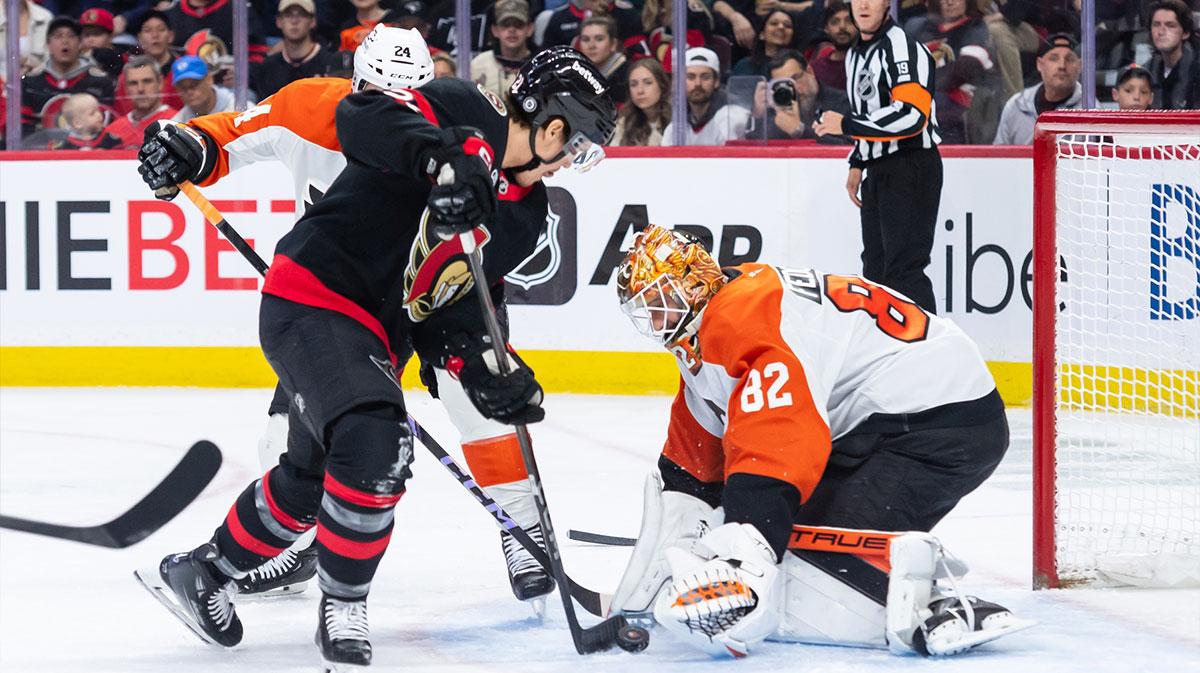 Philadelphia Flyers goalie Ivan Fedotov (82) makes a save in front of Ottawa Senators center Nick Cousins (21) in the first period at the Canadian Tire Centre.