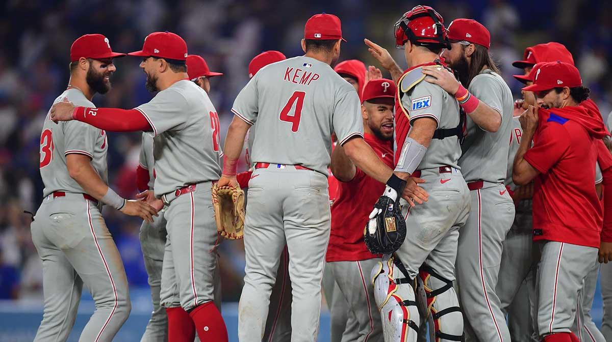Phillies surge past Mets to clinch NL East early after beating Dodgers, clearing path to possible World Series return.