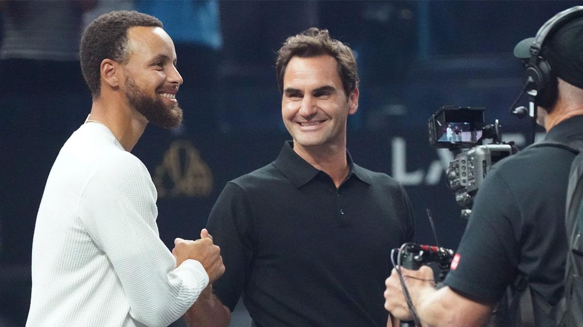 Golden State Warriors guard Stephen Curry greets Roger Federer before the coin toss at the Laver Cup at Chase Center.