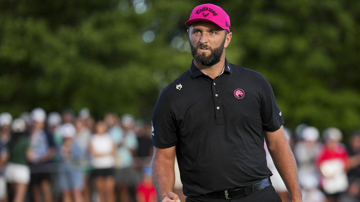 Jon Rahm of Legion XIII reacts to making his putt on the 18th green in a playoff hole during the finals of the LIV Golf Michigan Team Championship at The Cardinal at Saint John's Resort.