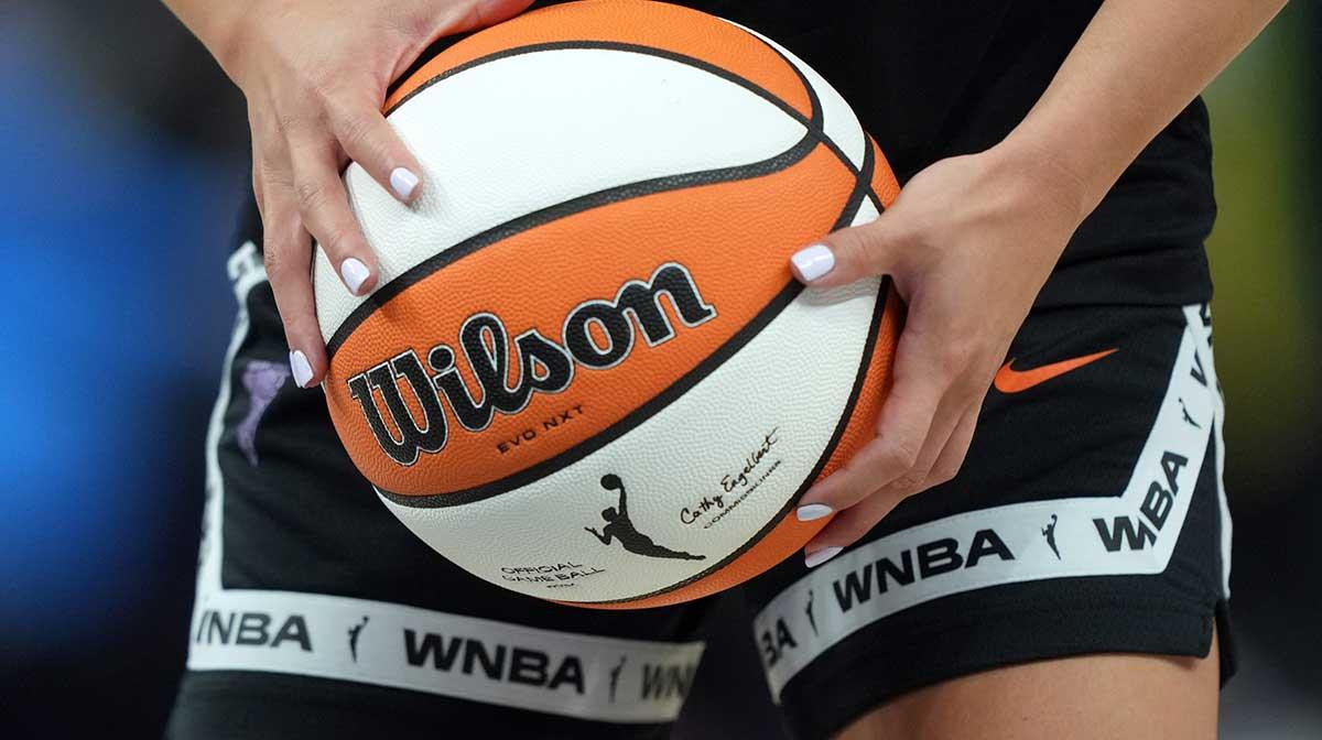 Golden State Valkyries guard Kaitlyn Chen (2) holds a ball as the WNBA logo appears on the ball and shorts before the game against the Indiana Fever at Chase Center.