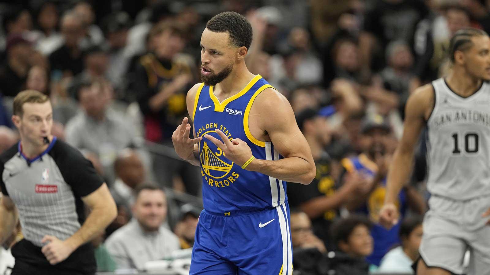 Golden State Warriors guard Stephen Curry (30) reacts after scoring a three-point basket during the second half against the San Antonio Spurs at Frost Bank Center.