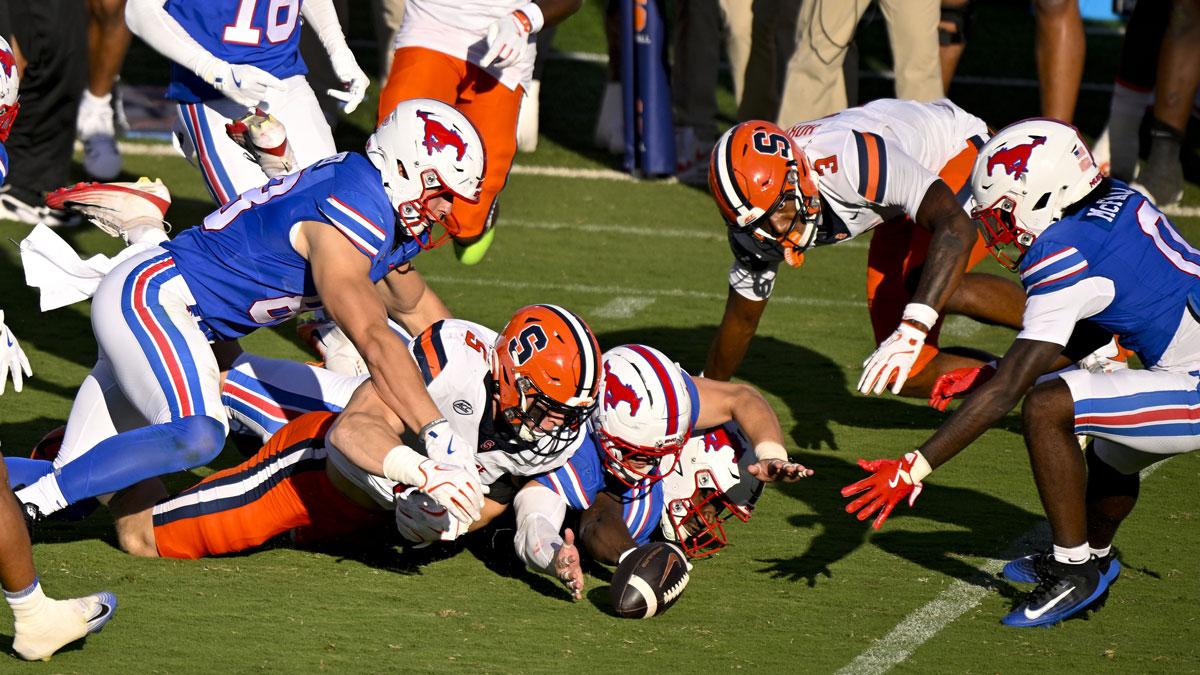 The SMU Mustangs and the Syracuse Orange battle for control of the ball on an onside kick attempt during the second half at Gerald J. Ford Stadium.