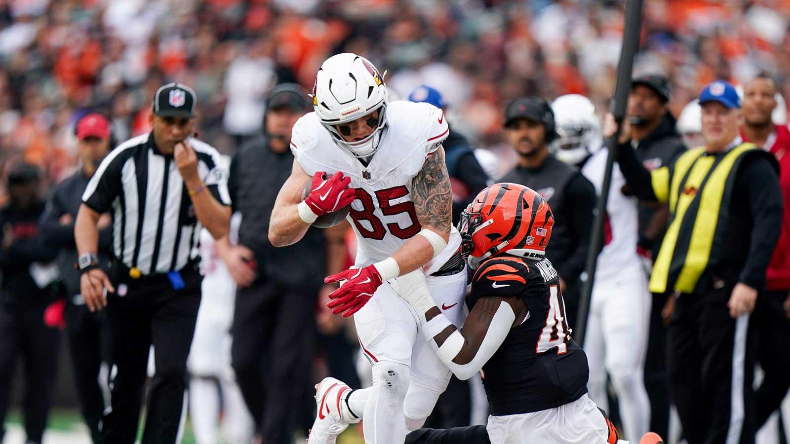 Cincinnati Bengals linebacker Demetrius Knight Jr. (44) pulls Arizona Cardinals tight end Trey McBride (85) out of bounds in the fourth quarter at Paycor Stadium.