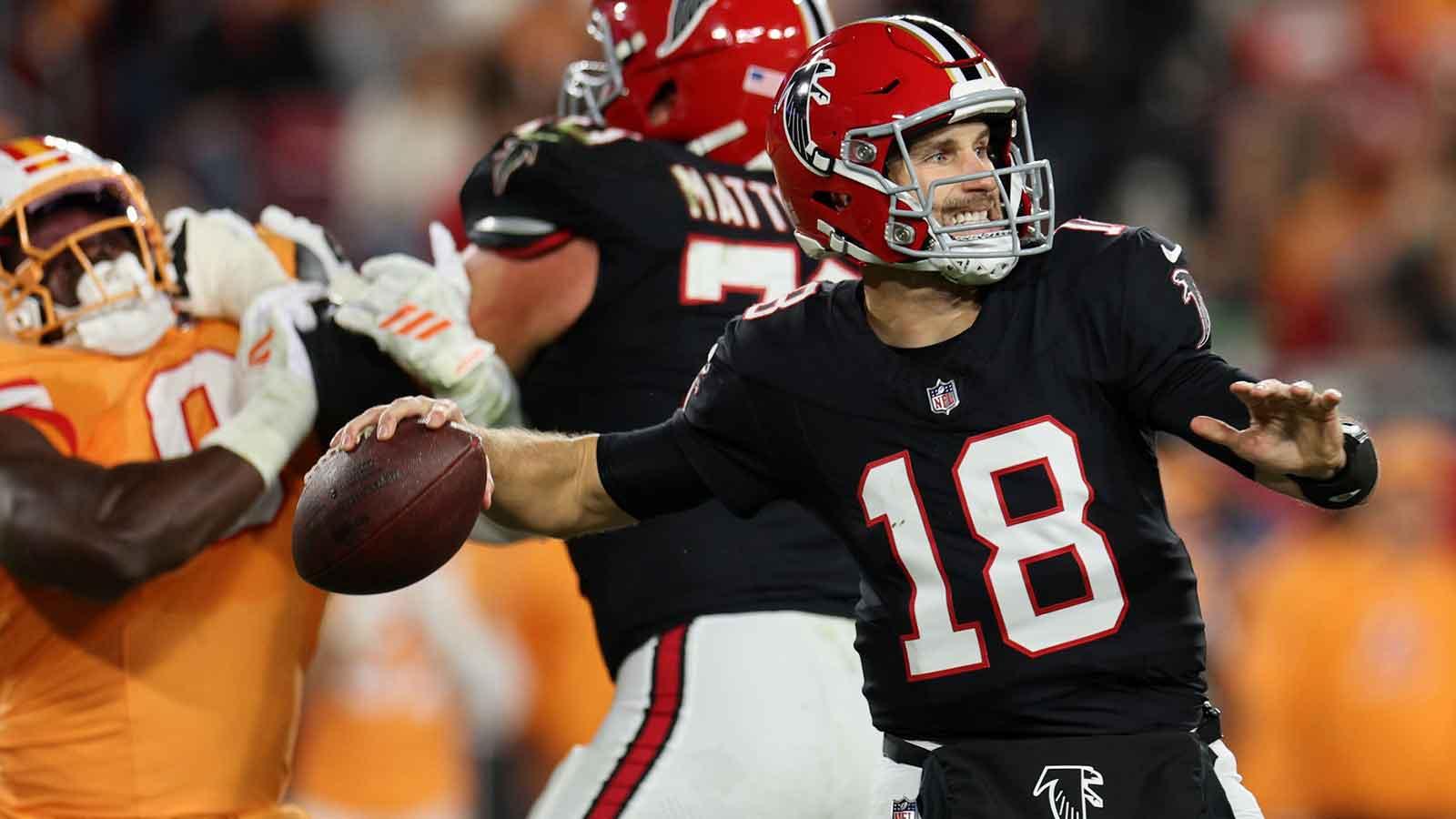 Atlanta Falcons quarterback Kirk Cousins (18) throws a pass and offensive tackle Jake Matthews (70) blocks against Tampa Bay Buccaneers linebacker Yaya Diaby (0) during the second quarter at Raymond James Stadium.