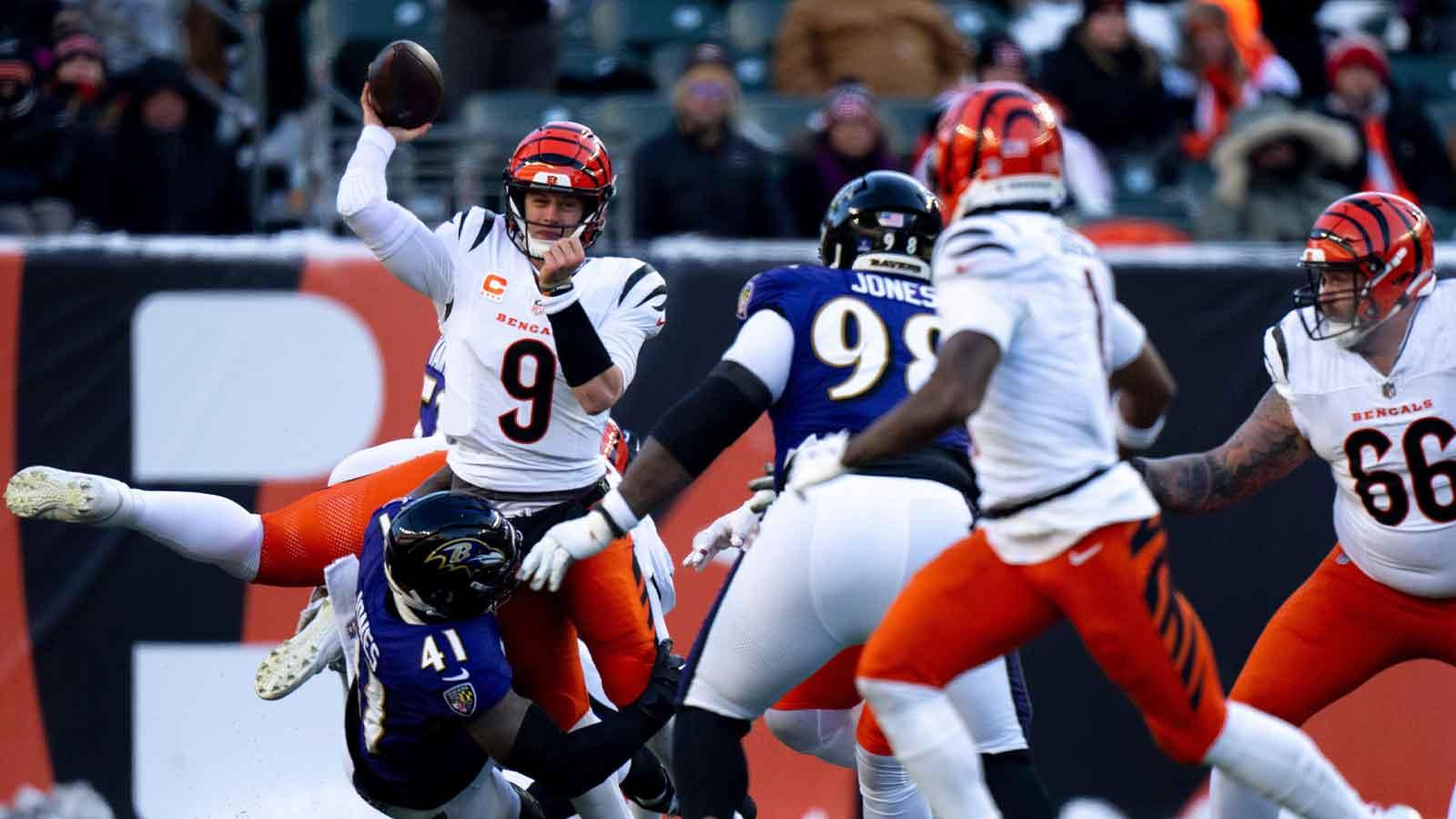 Baltimore Ravens defensive end Dre'Mont Jones (41) forces Cincinnati Bengals quarterback Joe Burrow (9) to throw an incomplete pass in the fourth quarter of the NFL football game at Paycor Stadium in Cincinnati on Dec. 14, 2025.