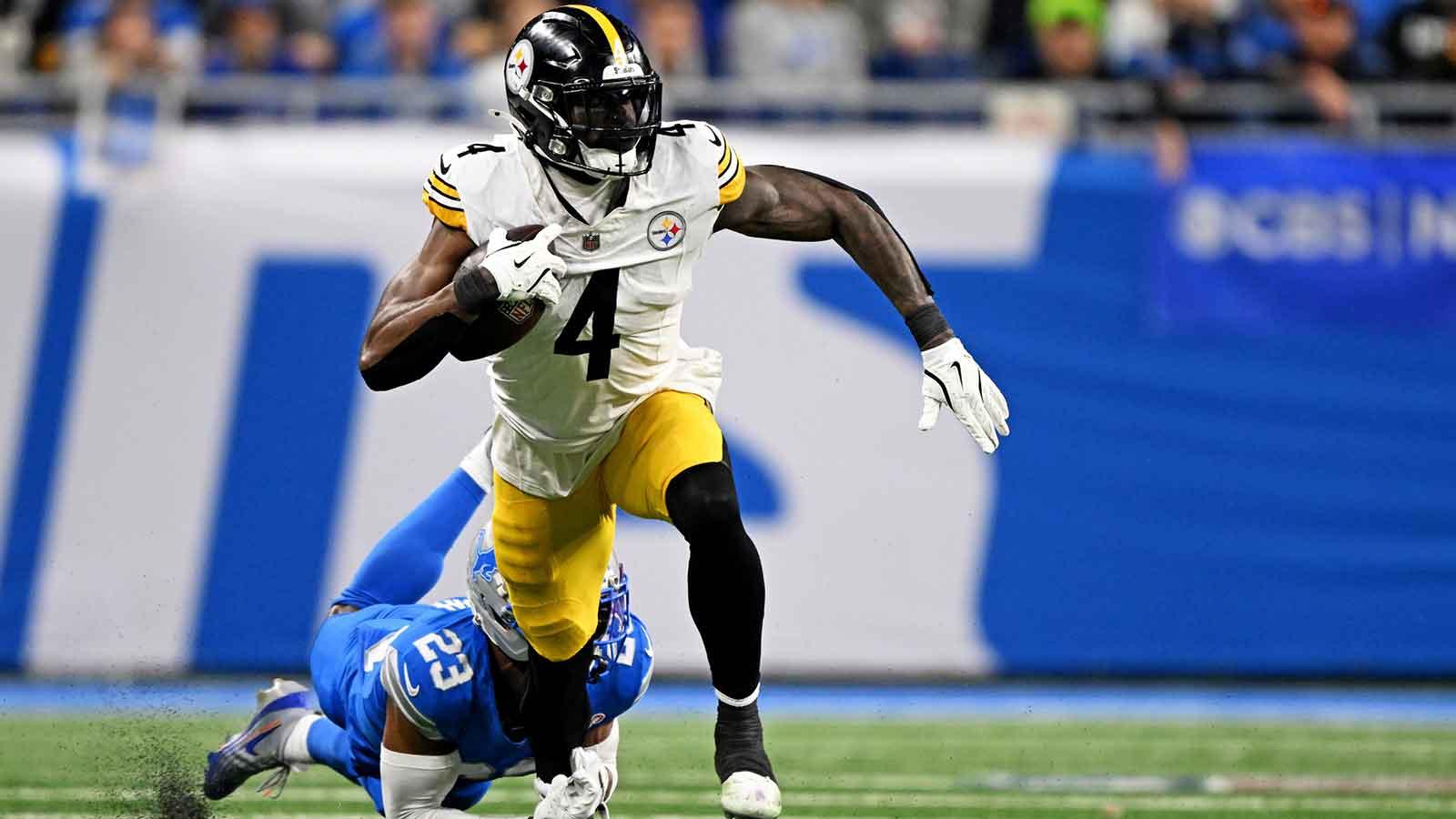 Detroit Lions cornerback Rock Ya-Sin (23) tackles Pittsburgh Steelers wide receiver DK Metcalf (4) during the fourth quarter at Ford Field.