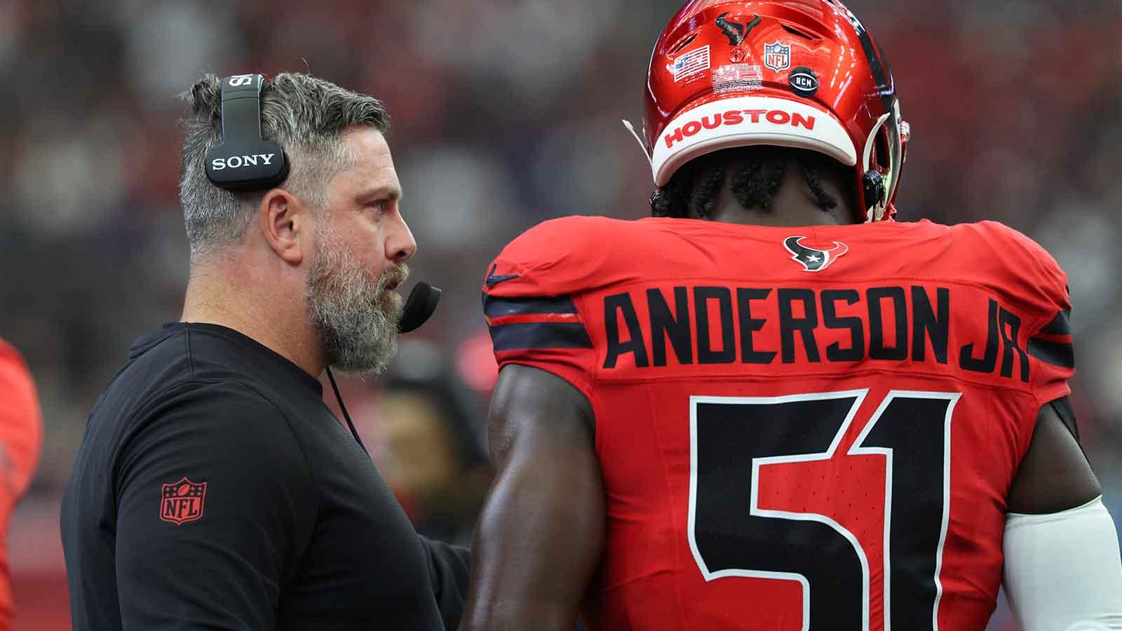Houston Texans defensive coordingaor Matt Burke talks with defensive end Will Anderson Jr. (51) during the game against the Las Vegas Raiders at NRG Stadium.