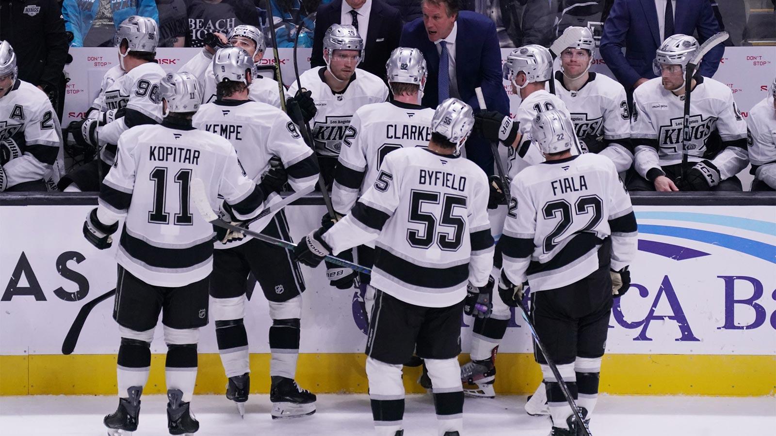 Los Angeles Kings head coach Jim Hiller talks with center Anze Kopitar (11), right winger Adrian Kempe (9), defenseman Brandt Clarke (92), right winger Quinton Byfield (55), left winger Kevin Fiala (22) and the team in the third period against the San Jose Sharks at SAP Center in San Jose.