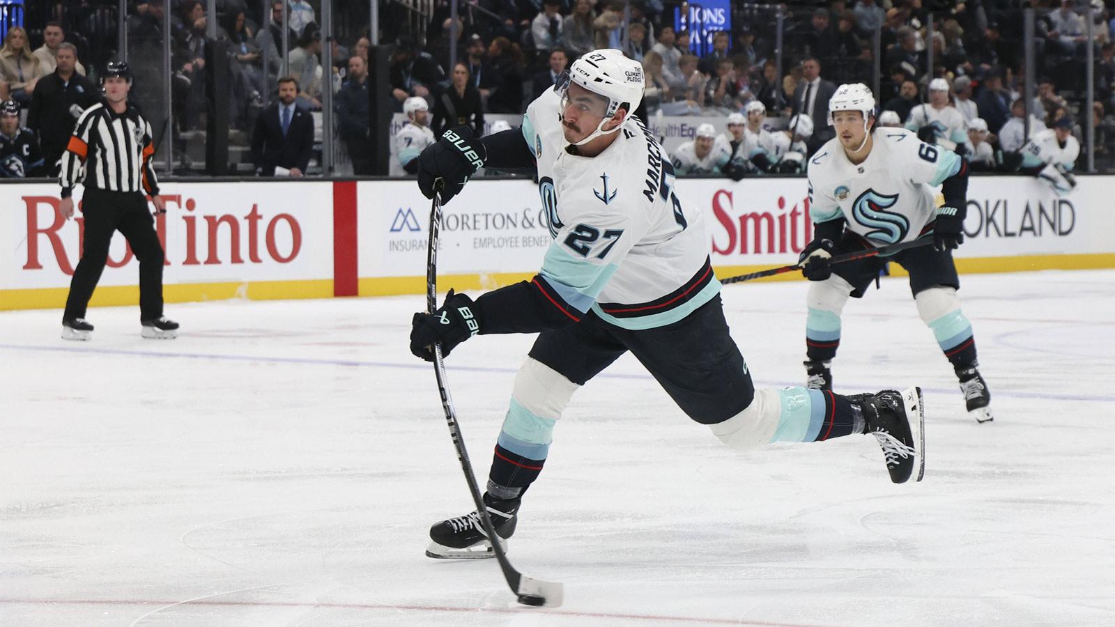Seattle Kraken left wing Mason Marchment (27) shoots the puck against the Utah Mammoth during the third period at Delta Center.