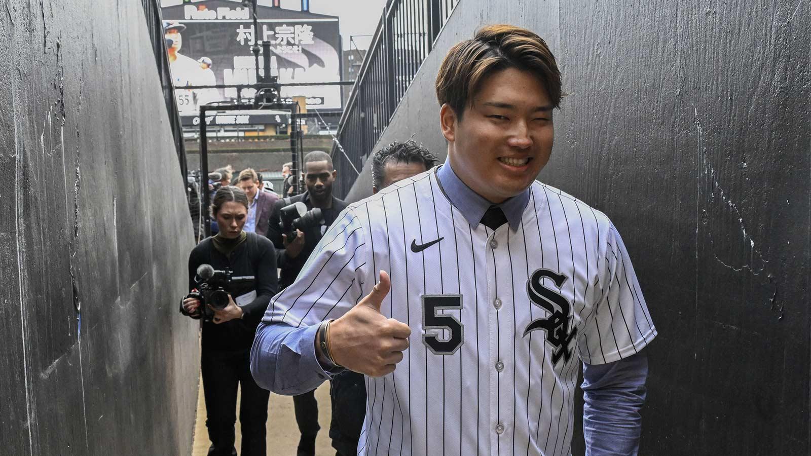 New Chicago White Sox player Munetaka Murakami gives a thumbs up after a press conference where he was introduced at Rate Field.