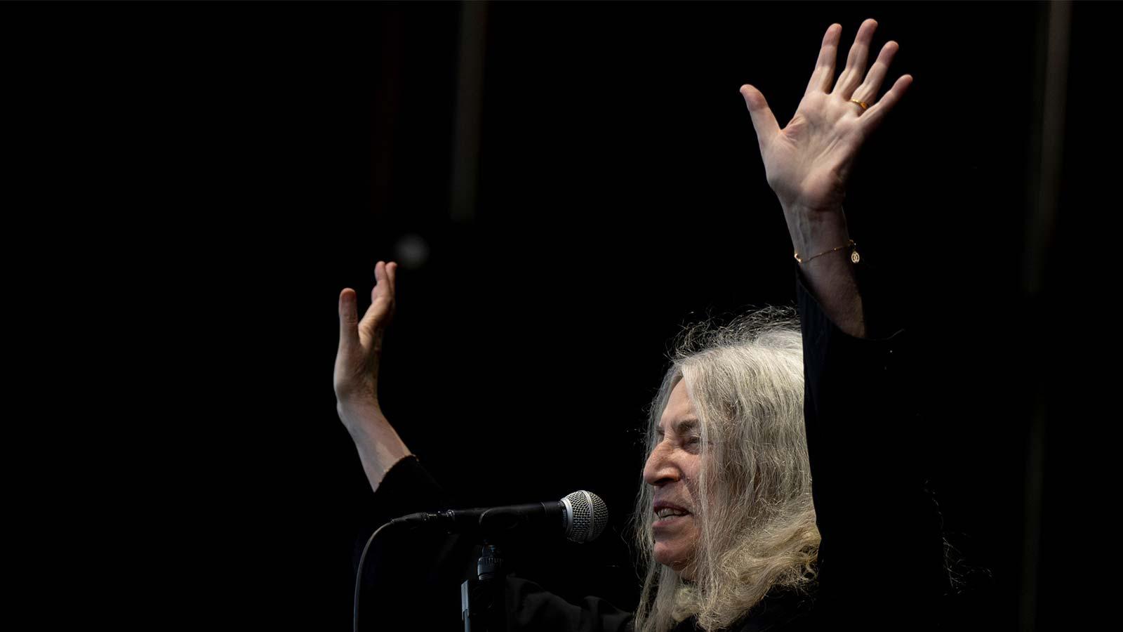 Patti Smith singing during a concert in 2023.