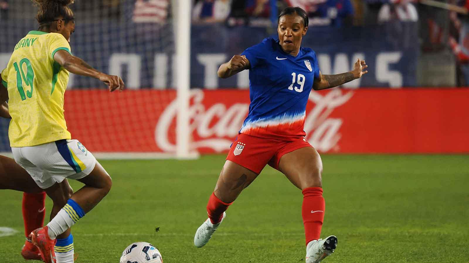 Brazil forward Luamy (19) and USWNT defender Crystal Dunn (19) extend for the ball during the second half at PayPal Park.