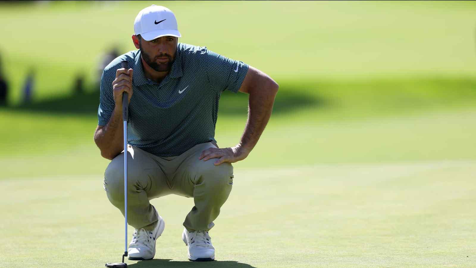 Scottie Scheffler lines up his putt on the 18th green during the final round of the The Genesis Invitational golf tournament at Riviera Country Club.