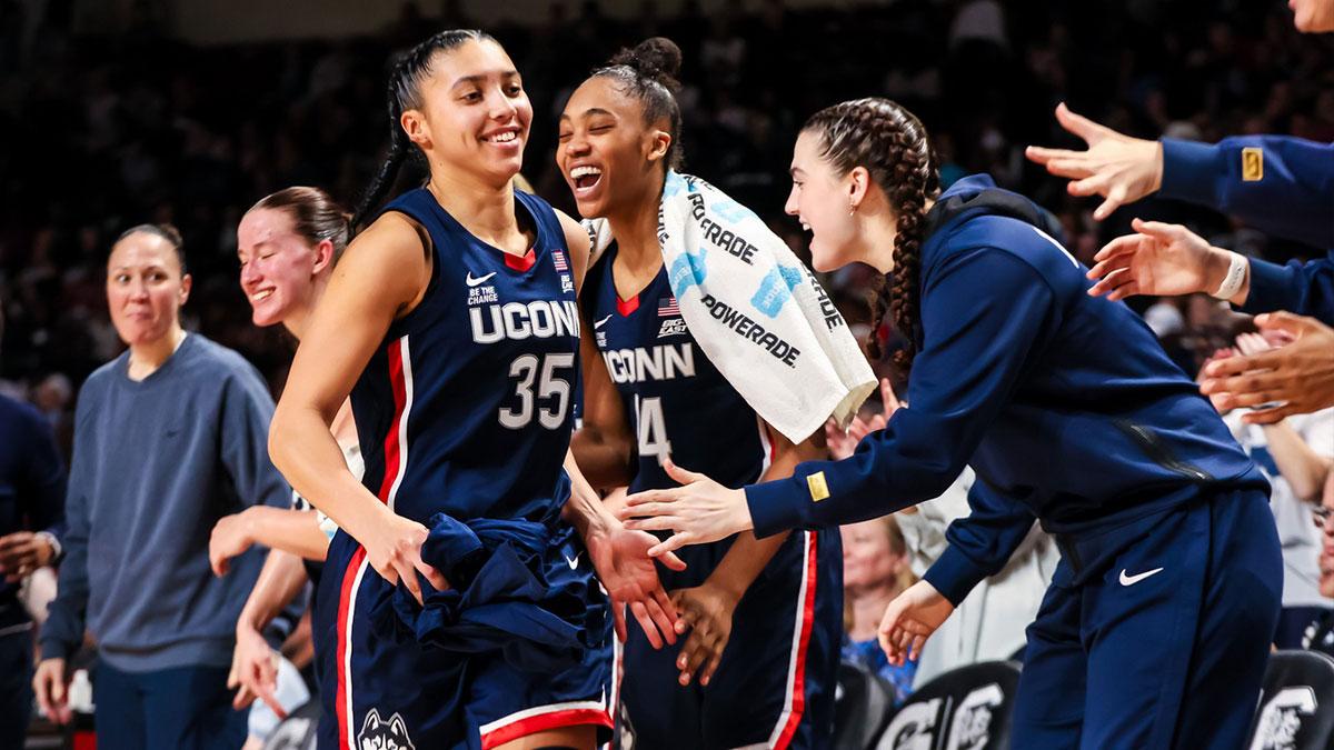 Feb 16, 2025; Columbia, South Carolina, USA; UConn Huskies guard Azzi Fudd (35) is congratulated after being pulled from the game against the South Carolina Gamecocks in the second half at Colonial Life Arena. Mandatory Credit: Jeff Blake-Imagn Images