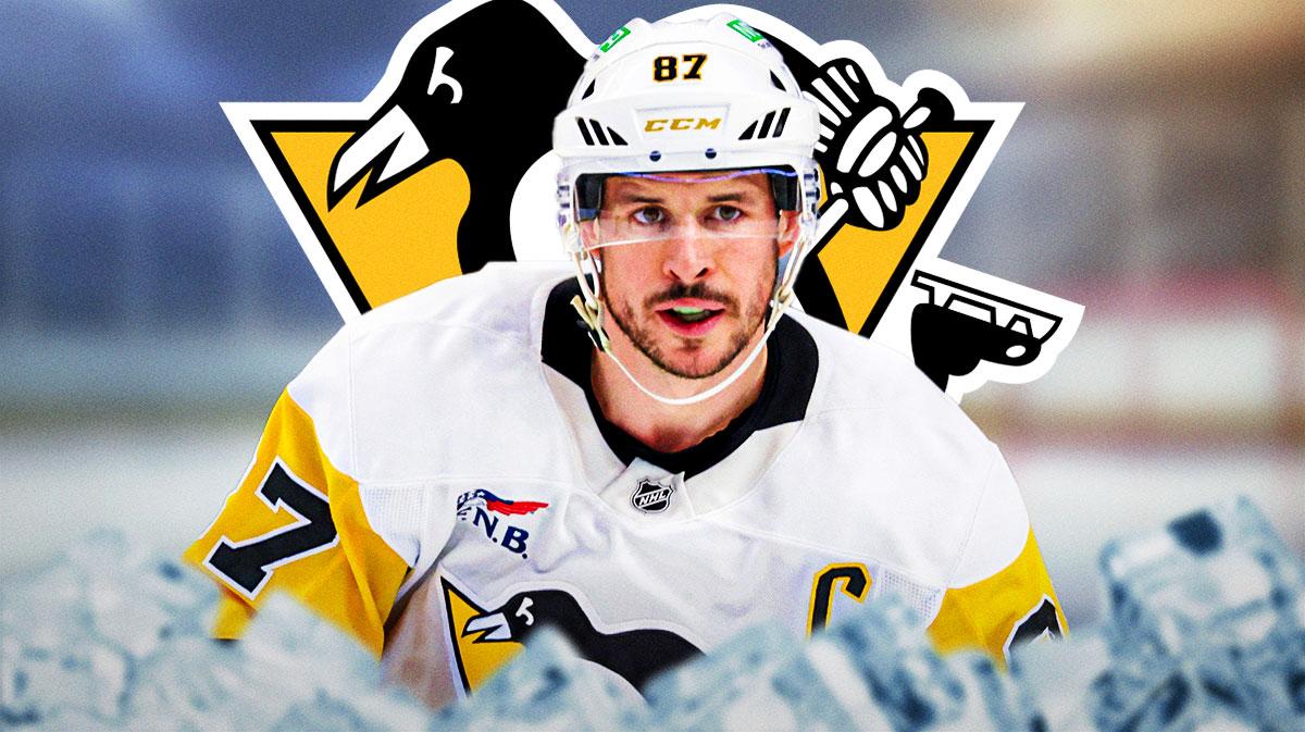 Sidney Crosby Penguins logo behind him.
