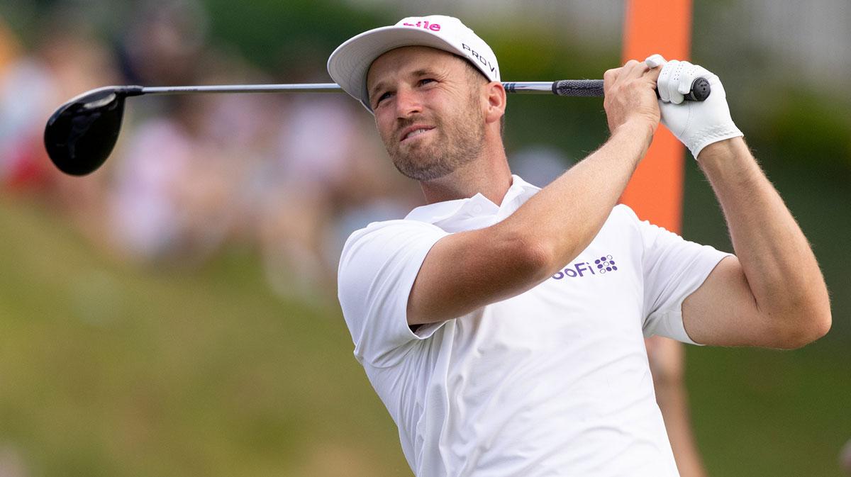 Wyndham Clark plays his shot from the 18th tee during the third round of the Travelers Championship golf tournament PGA Tour