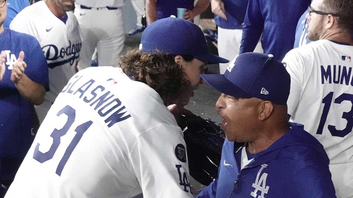 Dodgers manager Dave Roberts (30) speaks to starting pitcher Tyler Glasnow (31) after he was relieved after the seventh inning against the St. Louis Cardinals at Dodger Stadium
