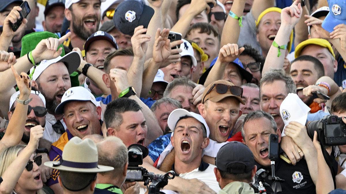 Team Europe golfer Matt Fitzpatrick and Team Europe golfer Rory McIlroy react with the crowd on the final day of competition for the Ryder Cup at Bethpage Black.
