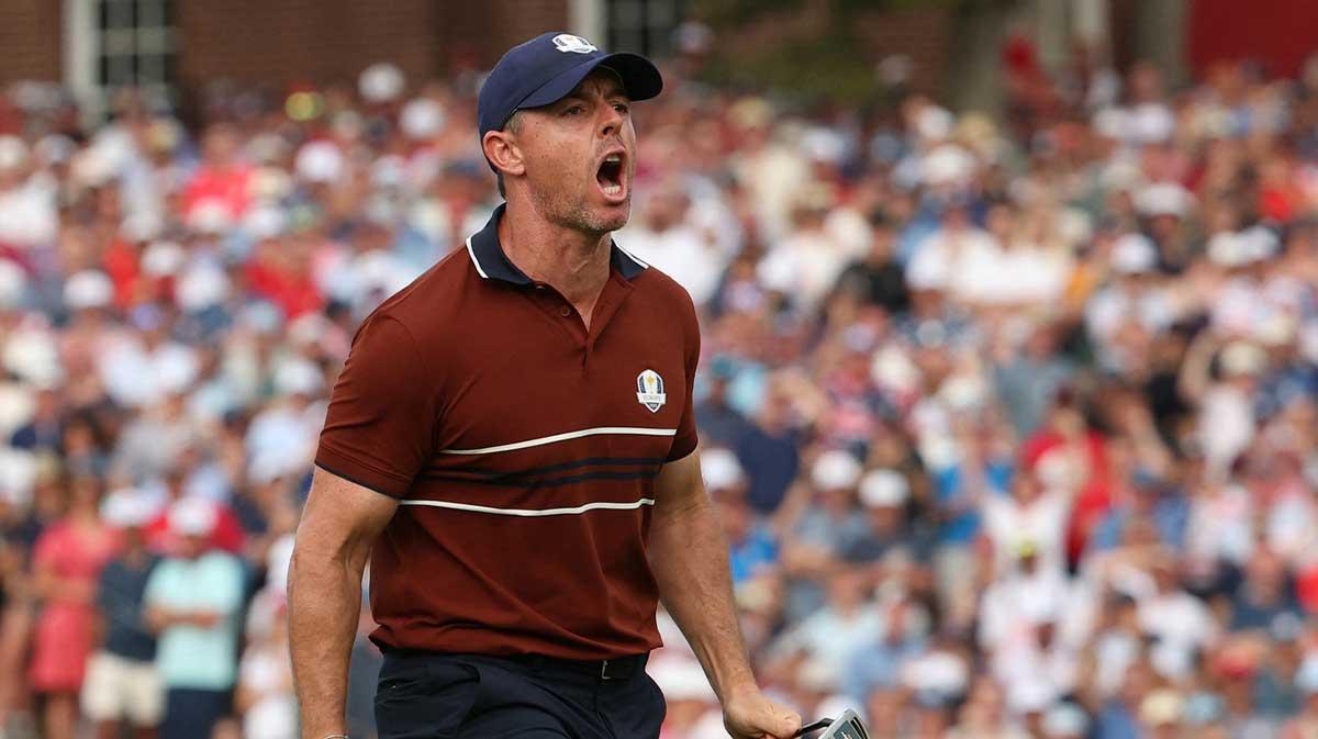 Team Europe's Rory McIlroy celebrates after holing his putt on the 14th hole during the four-balls on the second day of competition for the Ryder Cup at Bethpage Black.