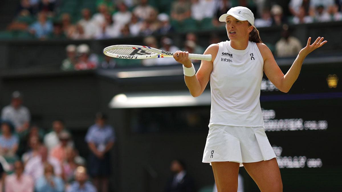 Iga Swiatek (POL) reacts after losing a point against Caty McNally (USA)(not pictured) on day four of The Championships Wimbledon 2025 at All England Lawn Tennis and Croquet Club.