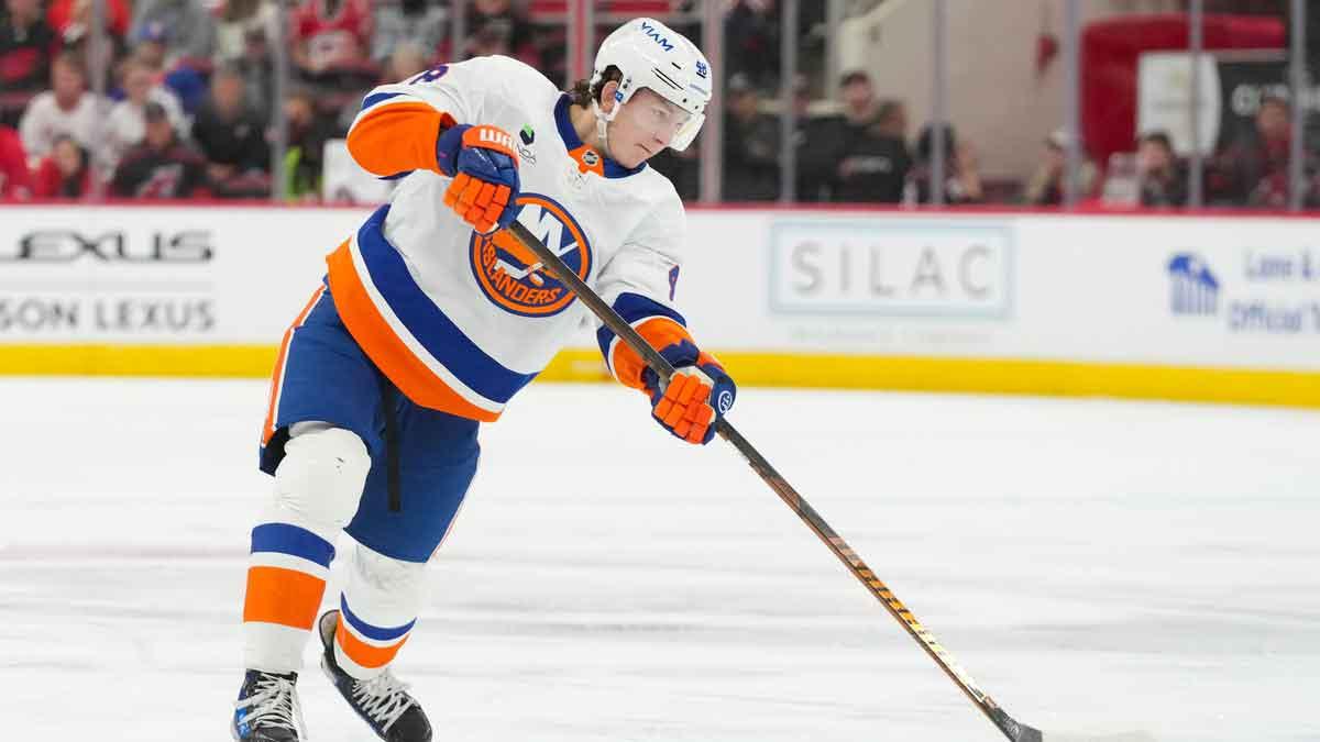 New York Islanders defenseman Matthew Schaefer (48) takes a shot against the Carolina Hurricanes during the second period at Lenovo Center.
