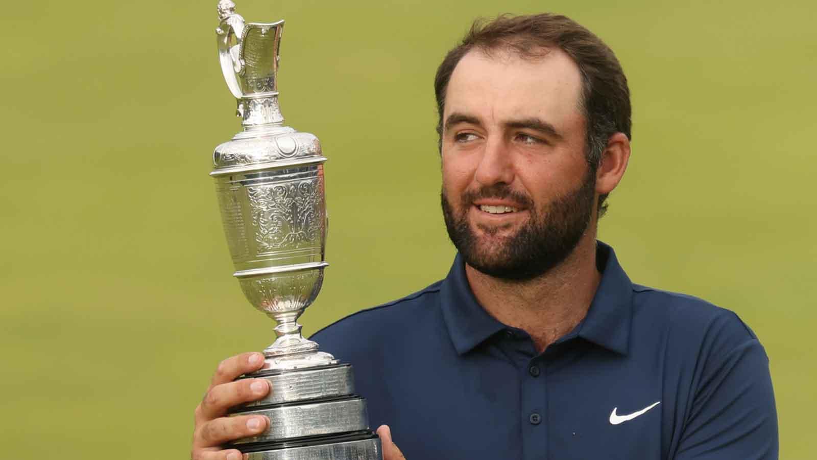 Jul 20, 2025; Portrush, IRL; Scottie Scheffler celebrates with the Claret Jug after winning the 153rd Open Championship golf tournament at Royal Portrush. Mandatory Credit: Mike Frey-Imagn Images