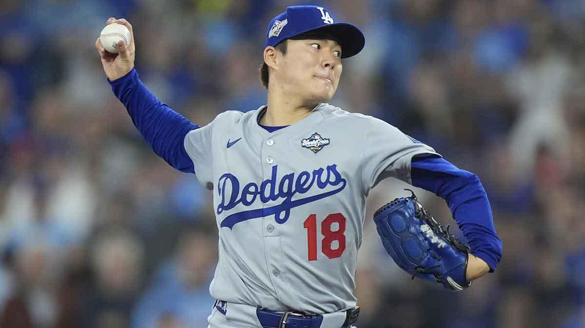 Los Angeles Dodgers pitcher Yoshinobu Yamamoto (18) pitches against the Toronto Blue Jays in the second inning during game six of the 2025 MLB World Series at Rogers Centre. Mandatory Credit: John E. Sokolowski-Imagn Images