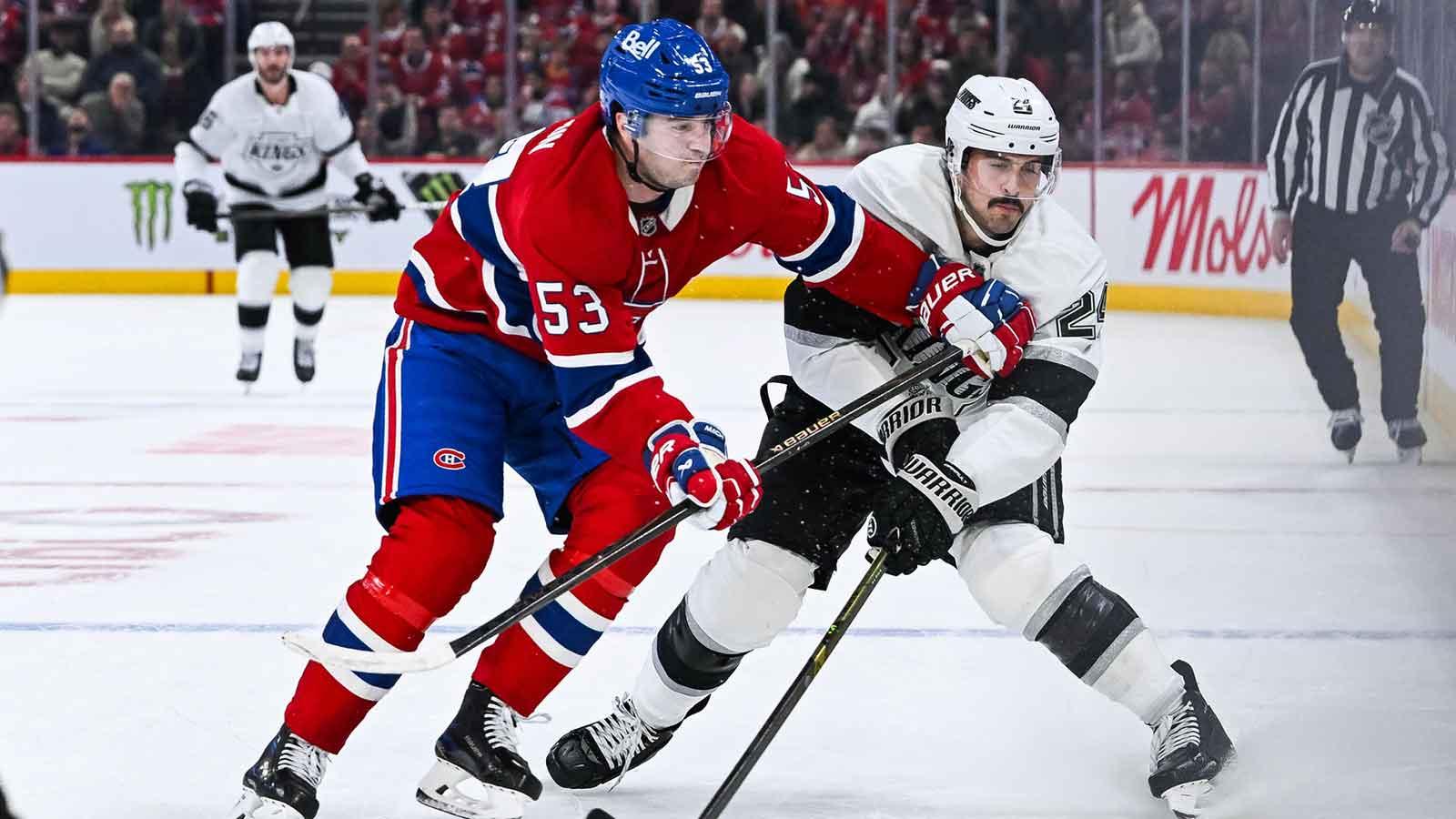 Montreal Canadiens defenseman Noah Dobson (53) defends against Los Angeles Kings center Phillip Danault (24) during the second period at Bell Centre.