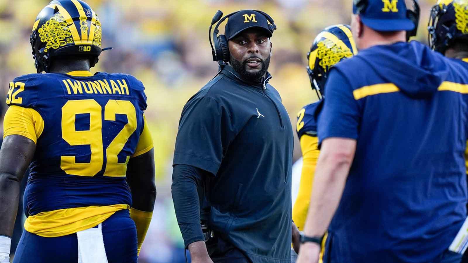 Michigan head coach Sherrone Moore talks to players at a timeout against USC during the second half at Michigan Stadium in Ann Arbor on Saturday, Sept. 21, 2024.