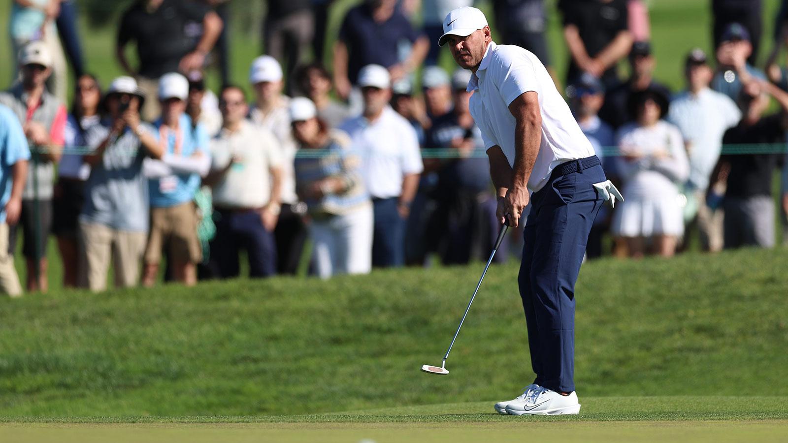 Brooks Koepka putts on the tenth green during the second round of the Farmers Insurance Open golf tournament at Torrey Pines Municipal Golf Course - South Course.