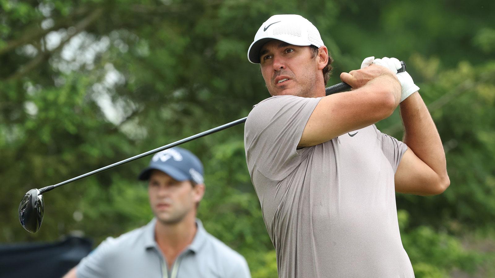 Brooks Koepka plays his shot from the first tee during the final round of the U.S. Open golf tournament.