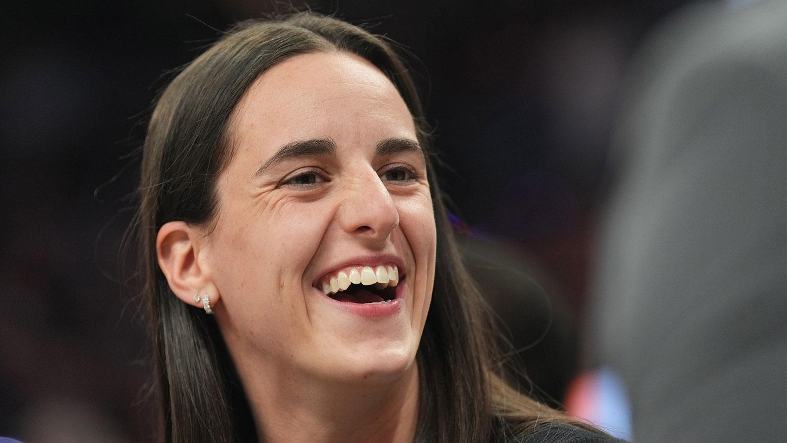 Indiana Fever player Caitlin Clark looks on during the second half of the game between the Phoenix Suns and the Golden State Warriors at Footprint Center.