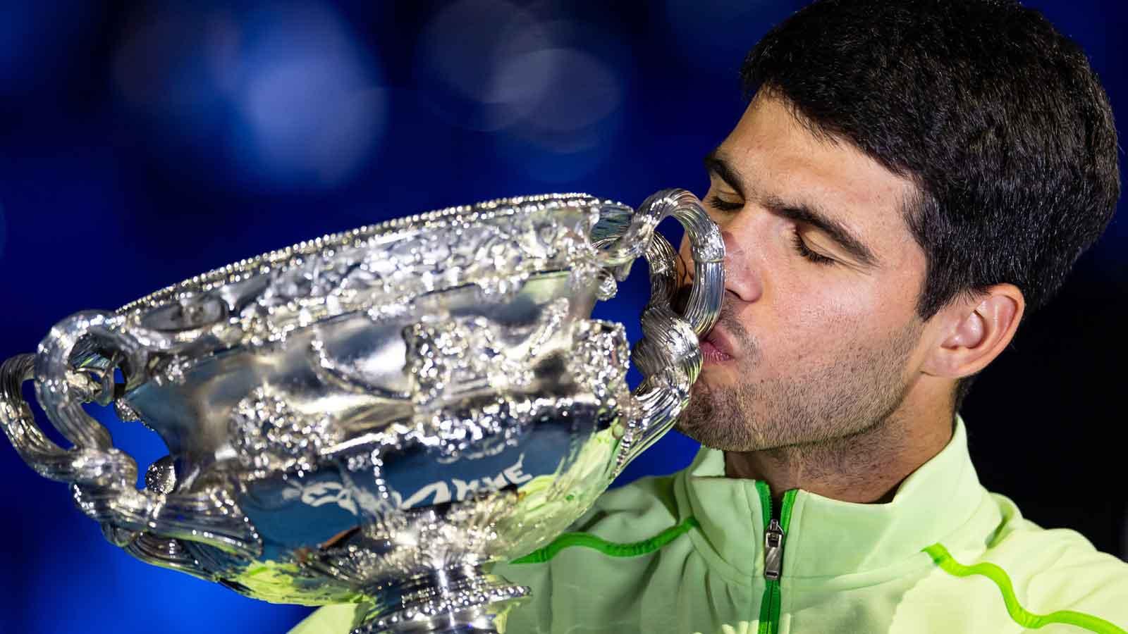 Carlos Alcaraz of Spain with the Norman Brookes Challenge Cup after his victory over Novak Djokovic of Serbia in the final of the menís singles at the Australian Open at Rod Laver Arena in Melbourne Park.