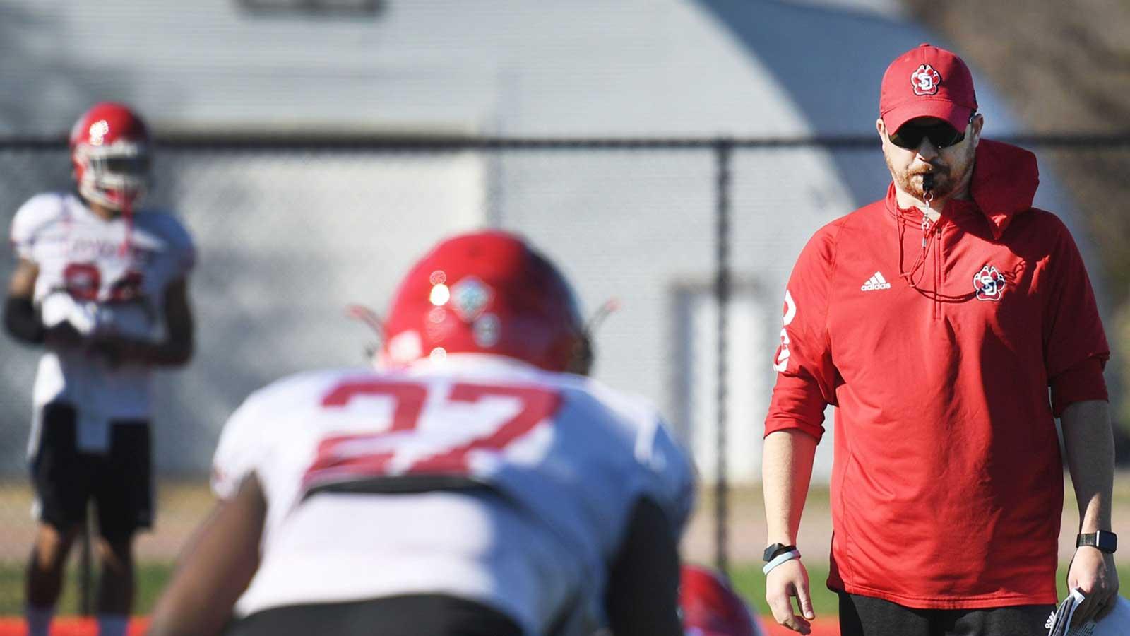 USD coach Travis Johansen during spring football camp Monday, April, 8, on the outdoor practice field at the university in Vermillion. Usd Spring Football 010