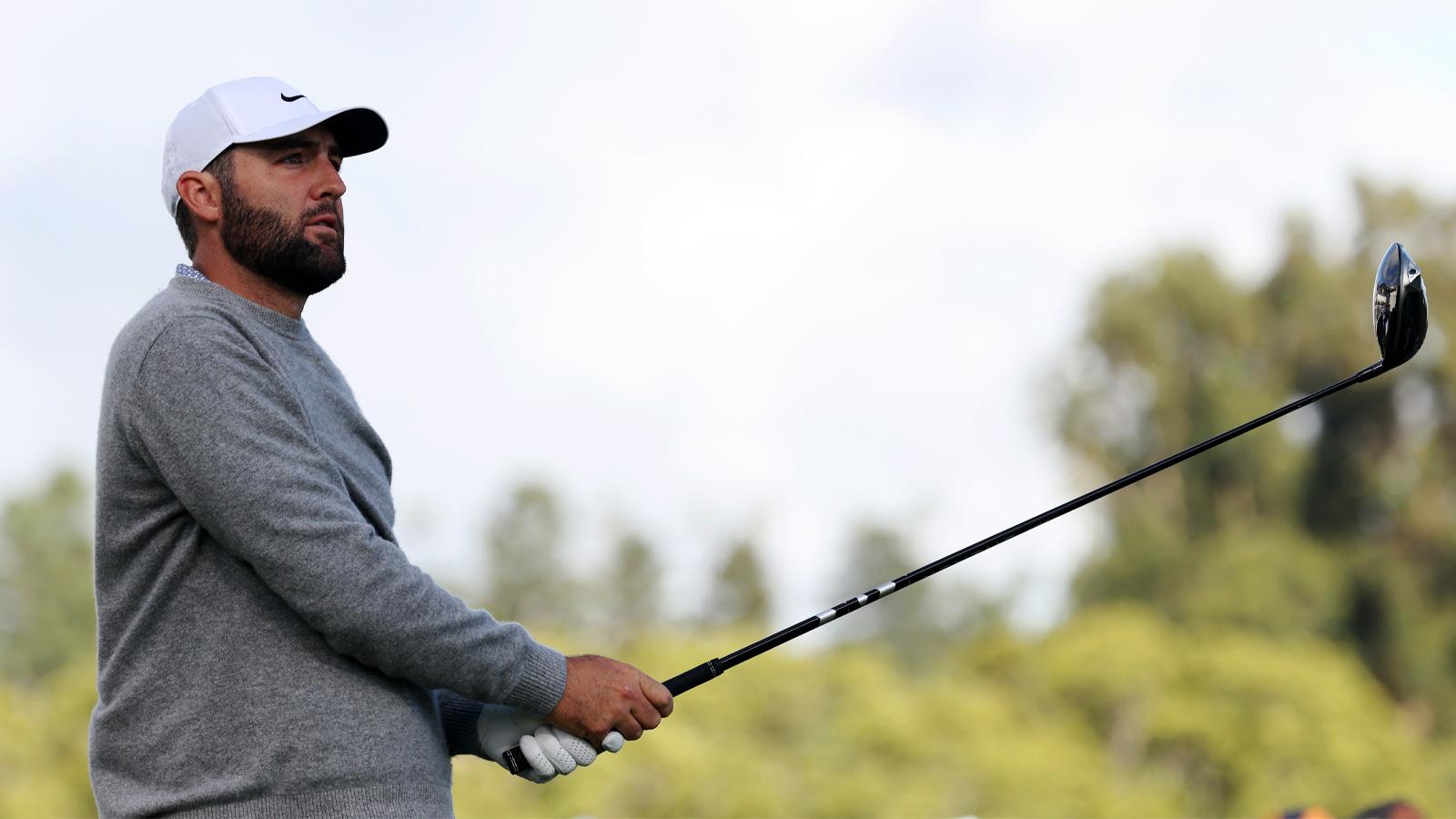 Scottie Scheffler watches his tee shot on the third hole during the first round of the The Genesis Invitational golf tournament at Riviera Country Club